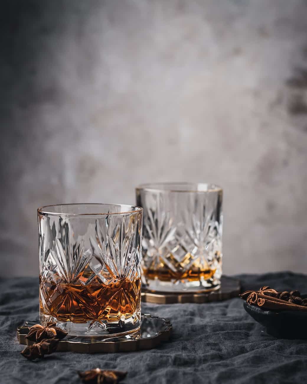 clear shot glass on black wooden table