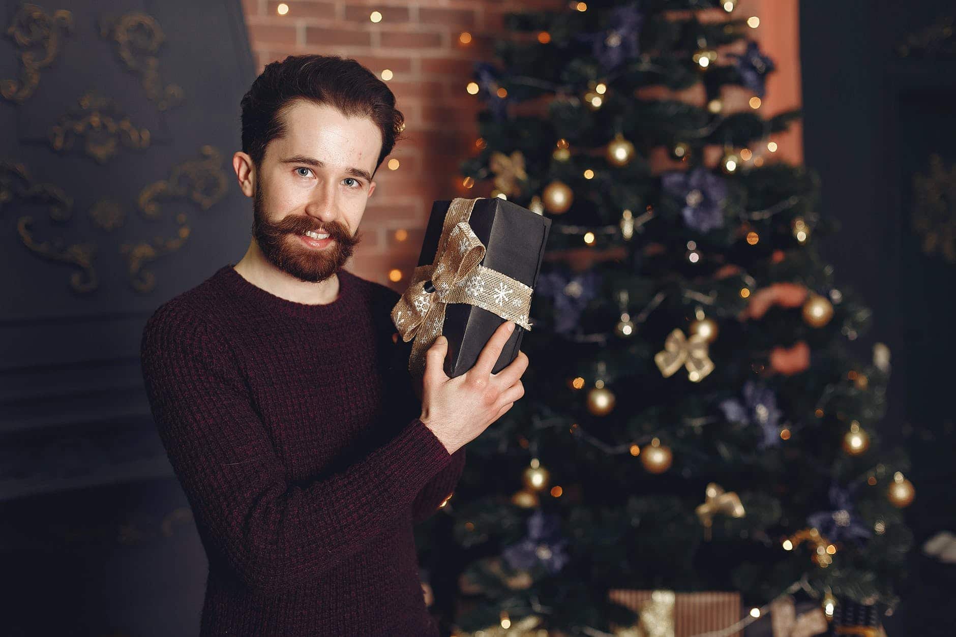 portrait of man with christmas gift