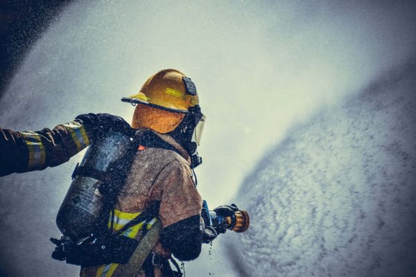 fireman holding fire hose