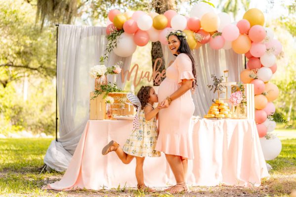 girl kissing her mother s belly