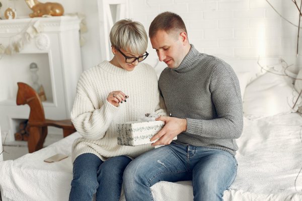 couple holding a christmas gift